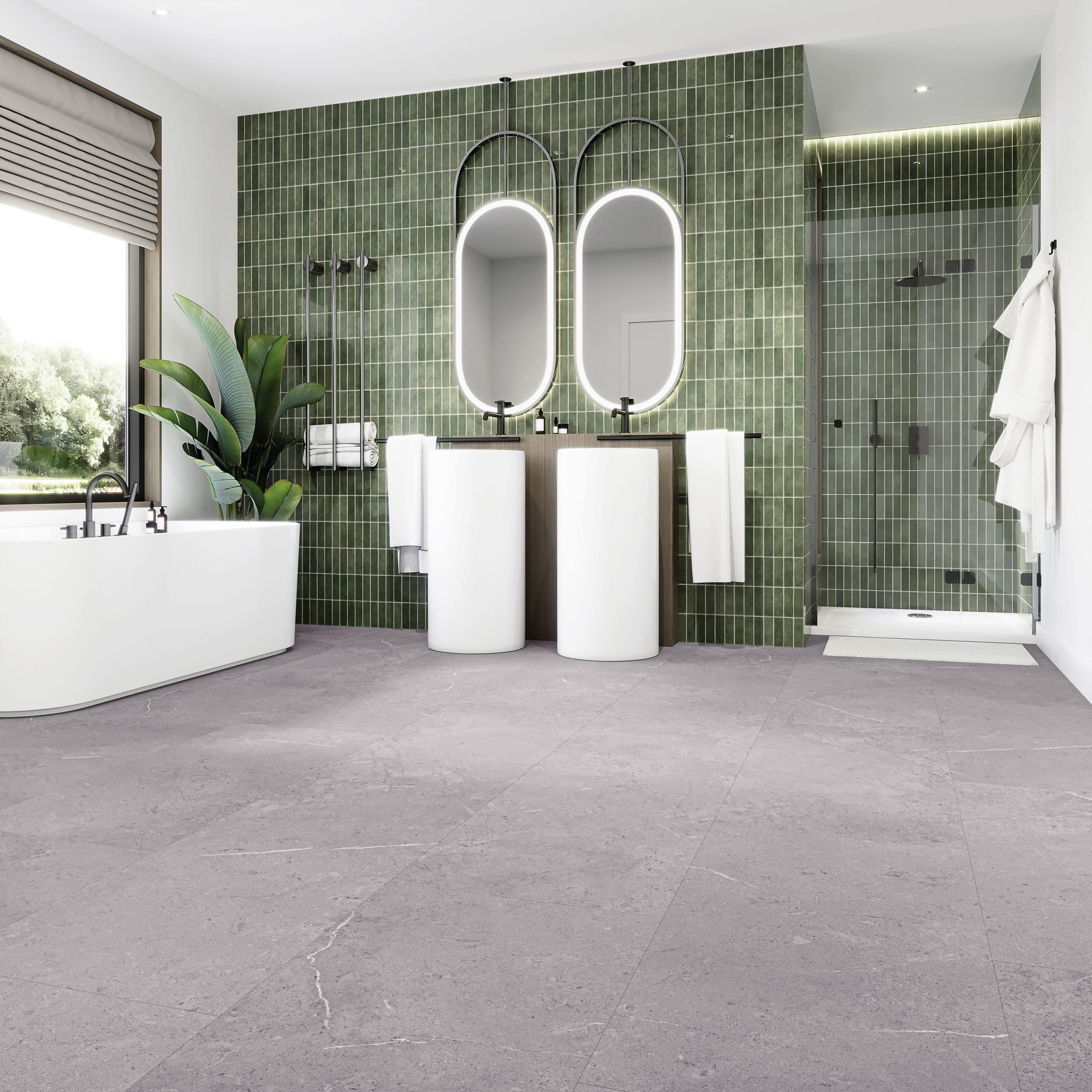Moderne Badezimmeransicht mit zwei runden Spiegeln über weißen Waschbecken, einer freistehenden Badewanne und einer begehbaren Dusche. Die Wände sind mit grünen Fliesen dekoriert, und es gibt eine Pflanze in der Ecke. Der Boden ist aus grauem Stein.